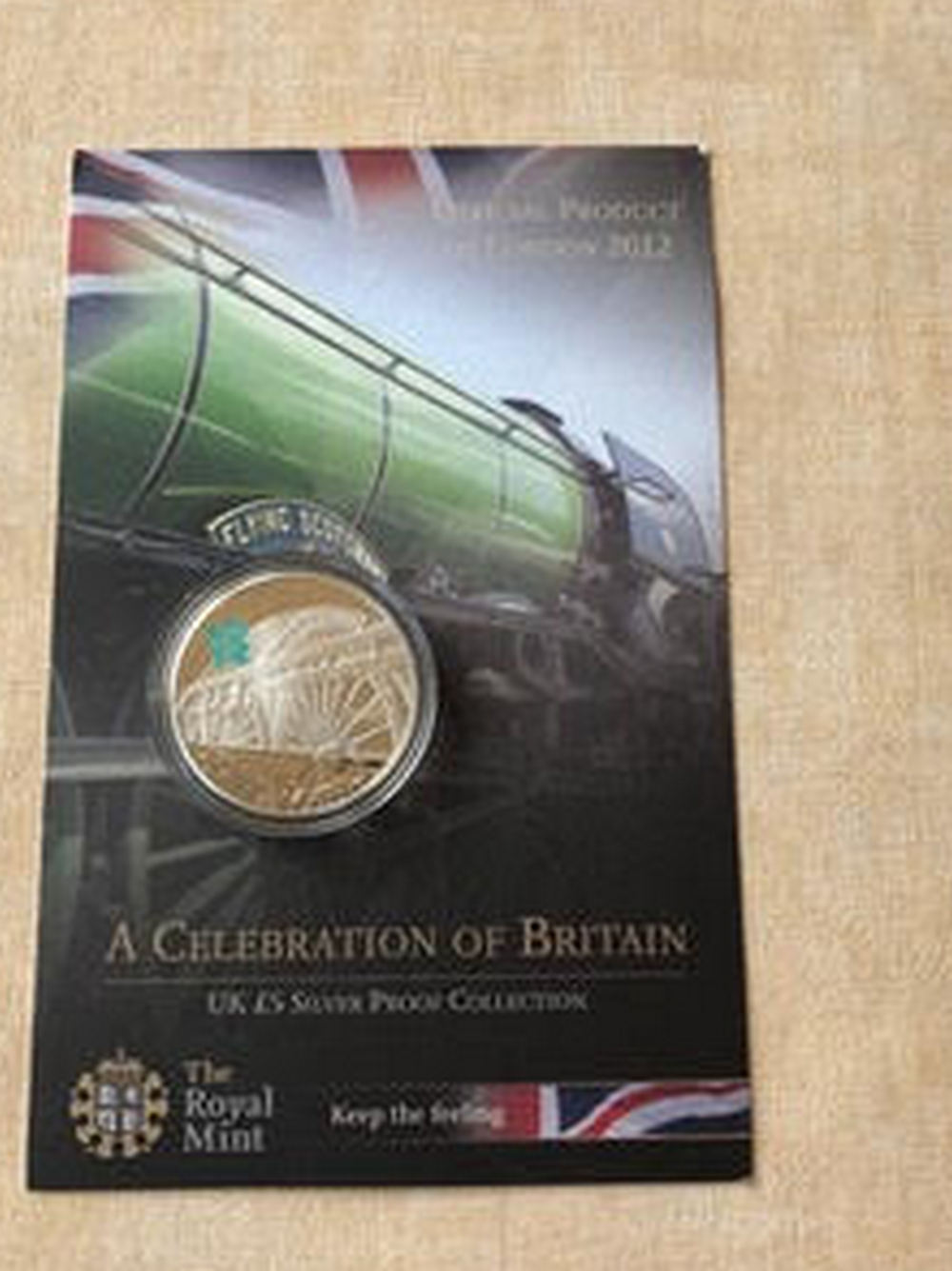 A 2009 £5 sterling 925 silver proof coin, weight 28.28g, in a protective case.