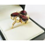 Yellow metal ring (tests as 18ct gold), set with 9mm x 7mm garnets&3mm cultured pearls.(Size P)-5.2g