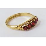 18ct gold ring set with garnets. Hallmarked Chester 1909. Size R. 3.7g