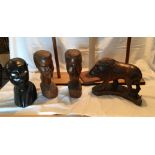 African Carvings of Lion and Heads some with wear and damage - Lion 34cm long - tallest heads 32cm.