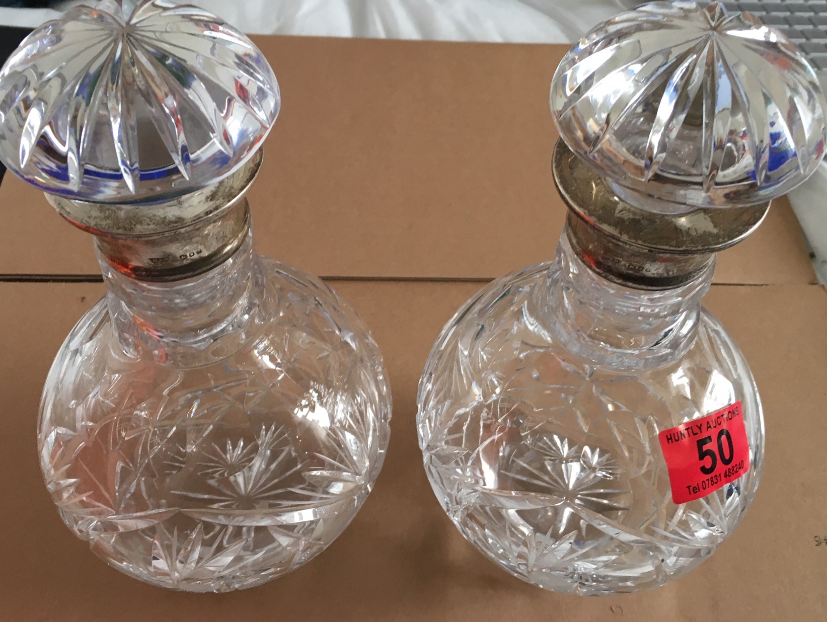 Pair of Vintage Silver Collared Crystal Decanter 9 3/4" tall and 5 1/2" at the widest.