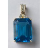 Yellow Metal and Blue Topaz Pendant - stone approx 20mm x 15mm x10mm deep.