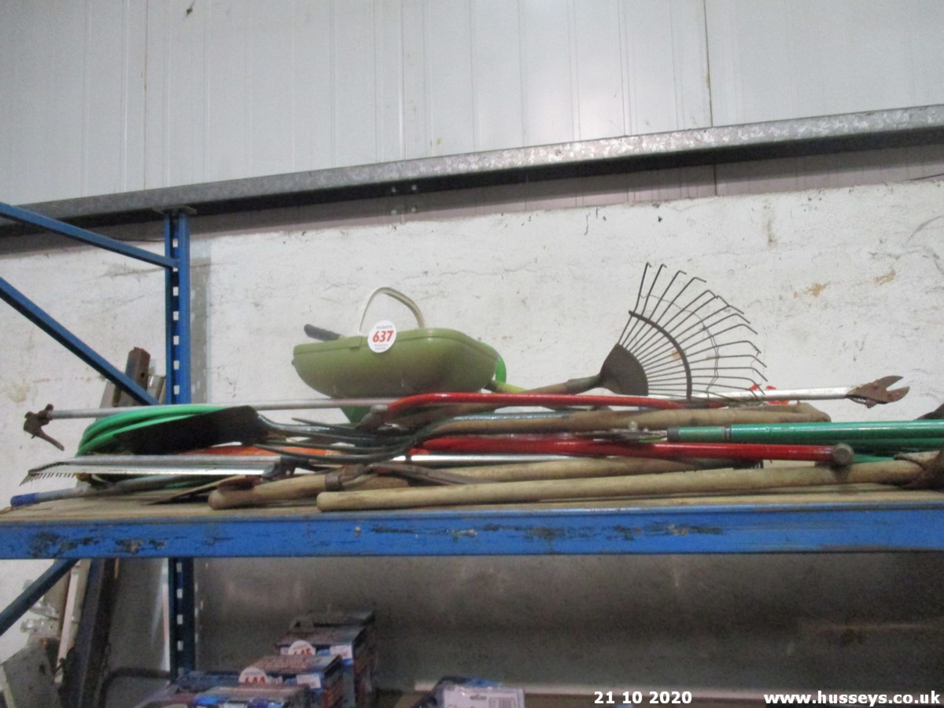 SHELF OF GARDENING TOOLS