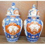 A pair of lidded Imari vases, 24cm