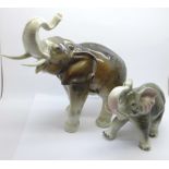 A Royal Dux model of an African elephant and one other figure