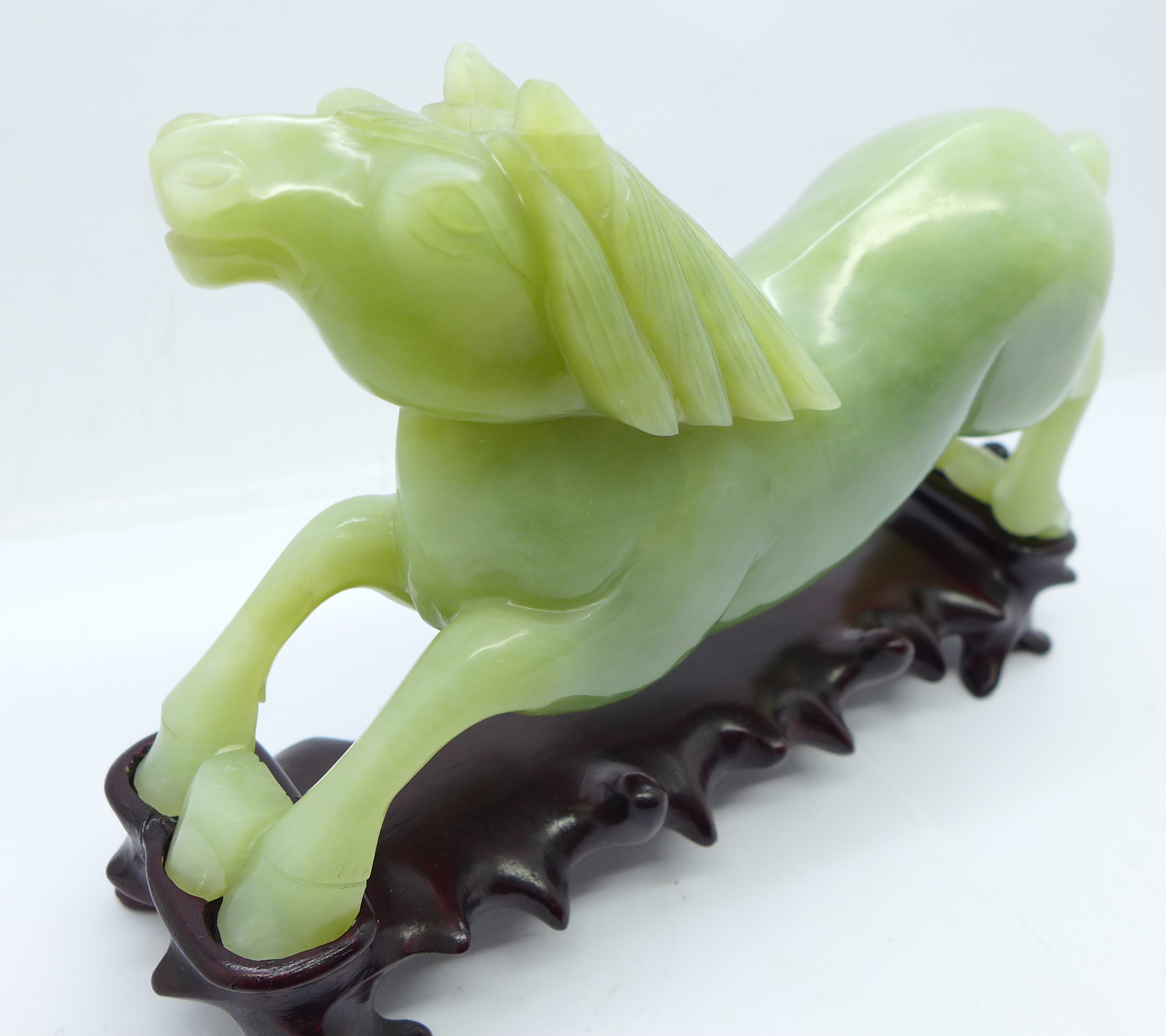 A Chinese carved jade figure of a horse, 18.5cm, on a wooden stand - Image 2 of 3