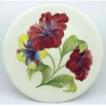 A Moorcroft hibiscus pattern plate, 26cm