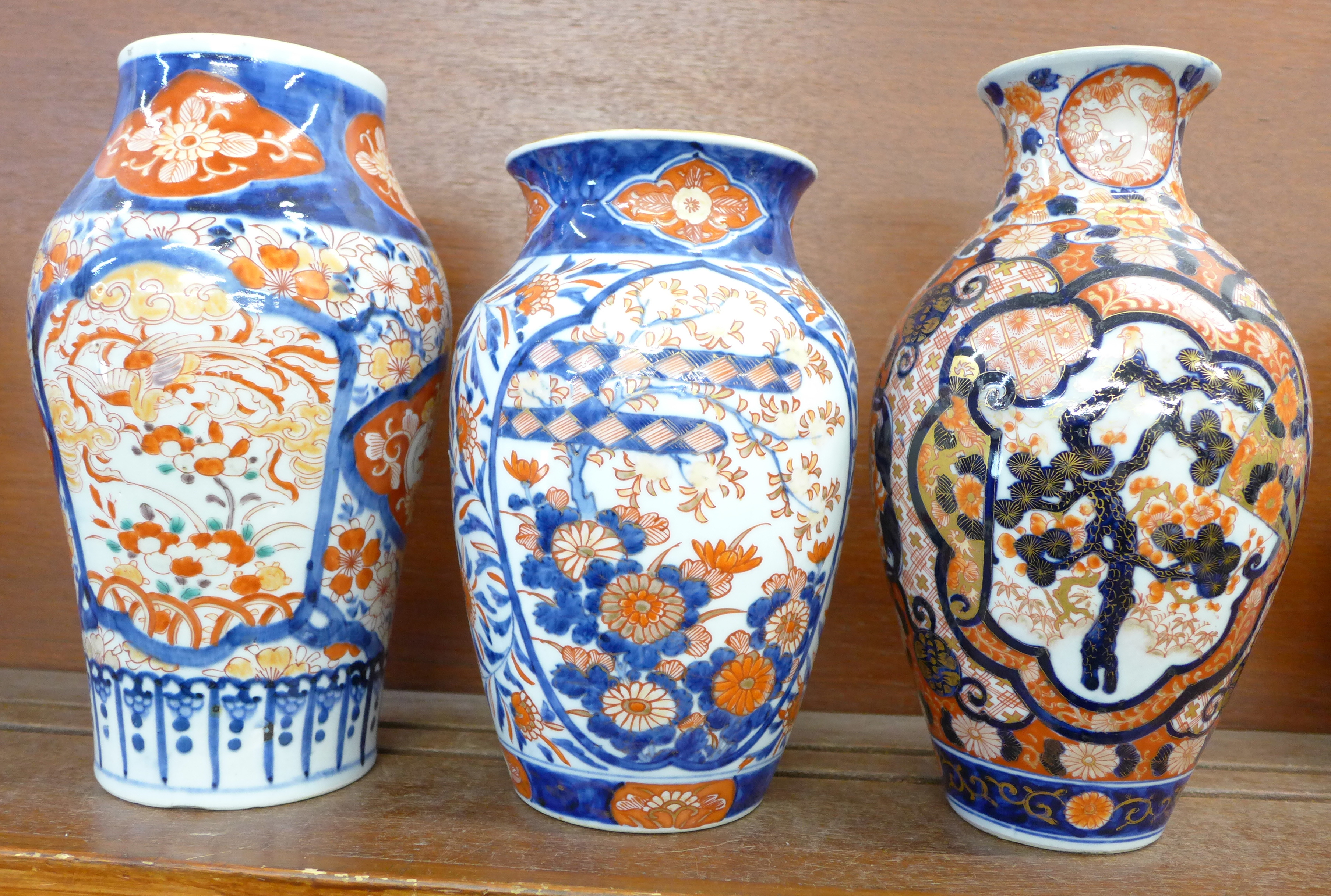 Three early 20th Century Imari vases, tallest 26cm