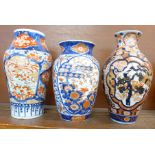 Three early 20th Century Imari vases, tallest 26cm