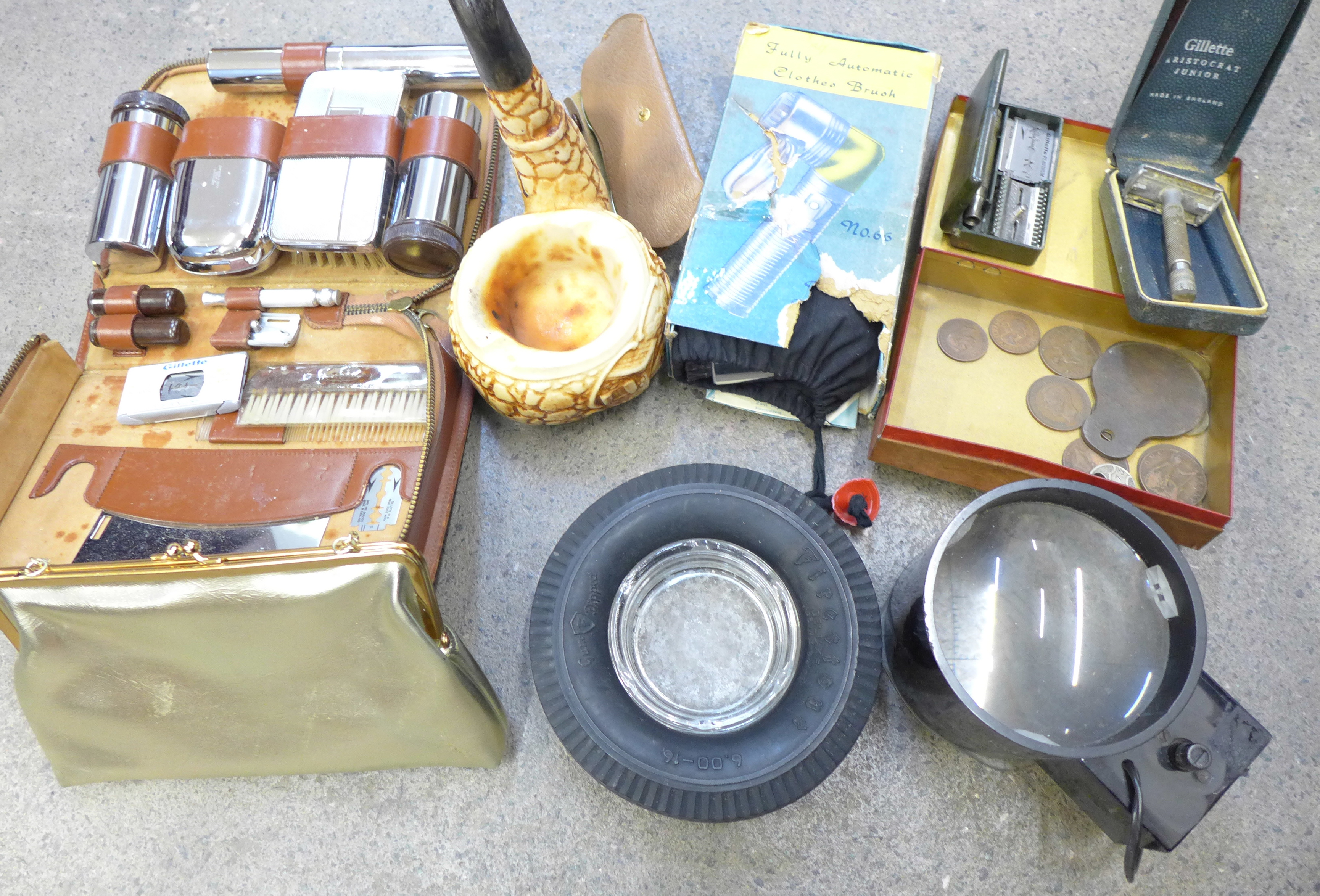 A Hohner Chromonica, a catapult, a pipe and two pipe rests, a magnifier, a gentleman's travel vanity