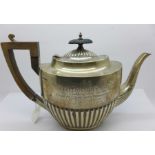 A silver teapot, with a L.M. & S. Railway related inscription dated 1930, 677g, a/f, dented