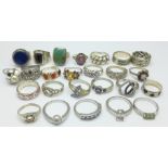 Twenty-five silver rings, one set with garnet and opal