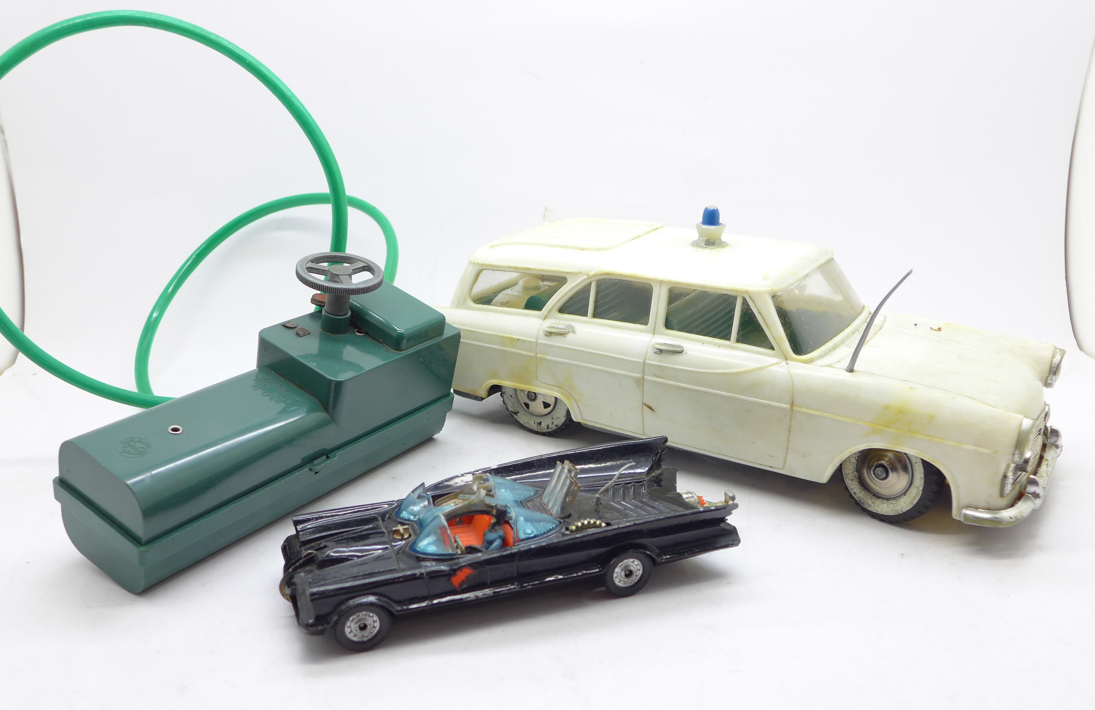 A battery operated remote control M1 Police Car, by Marx Toys, and a Corgi Toys Batmobile, a/f