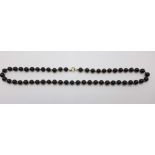 A 9ct gold and black bead necklace, 16.4g