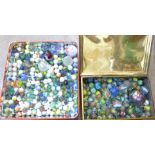 Two tins of marbles