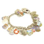 A silver and enamelled charm bracelet, 38g