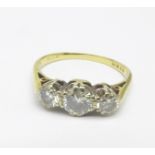 An 18ct gold, three stone diamond ring, over 1carat total diamond weight, 2.8g, M