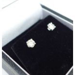 A pair of 18ct white gold, diamond stud earrings, total diamond weight 0.49ct