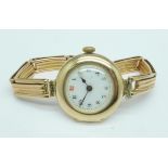 A lady's 9ct gold wristwatch and bracelet strap, London 1912, 19.4g gross weight, the case back