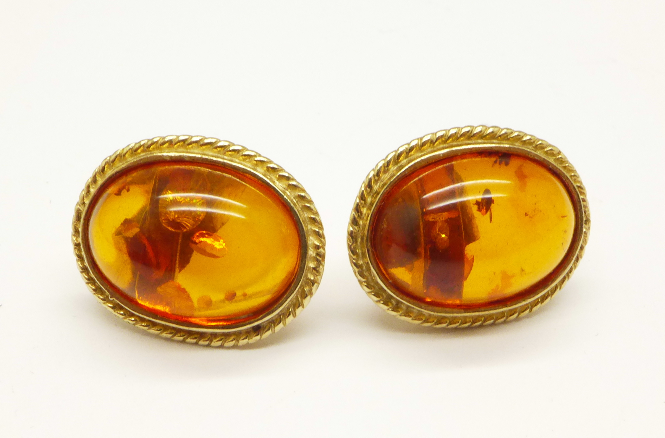 A pair of 9ct gold and amber ear studs, 3.9g