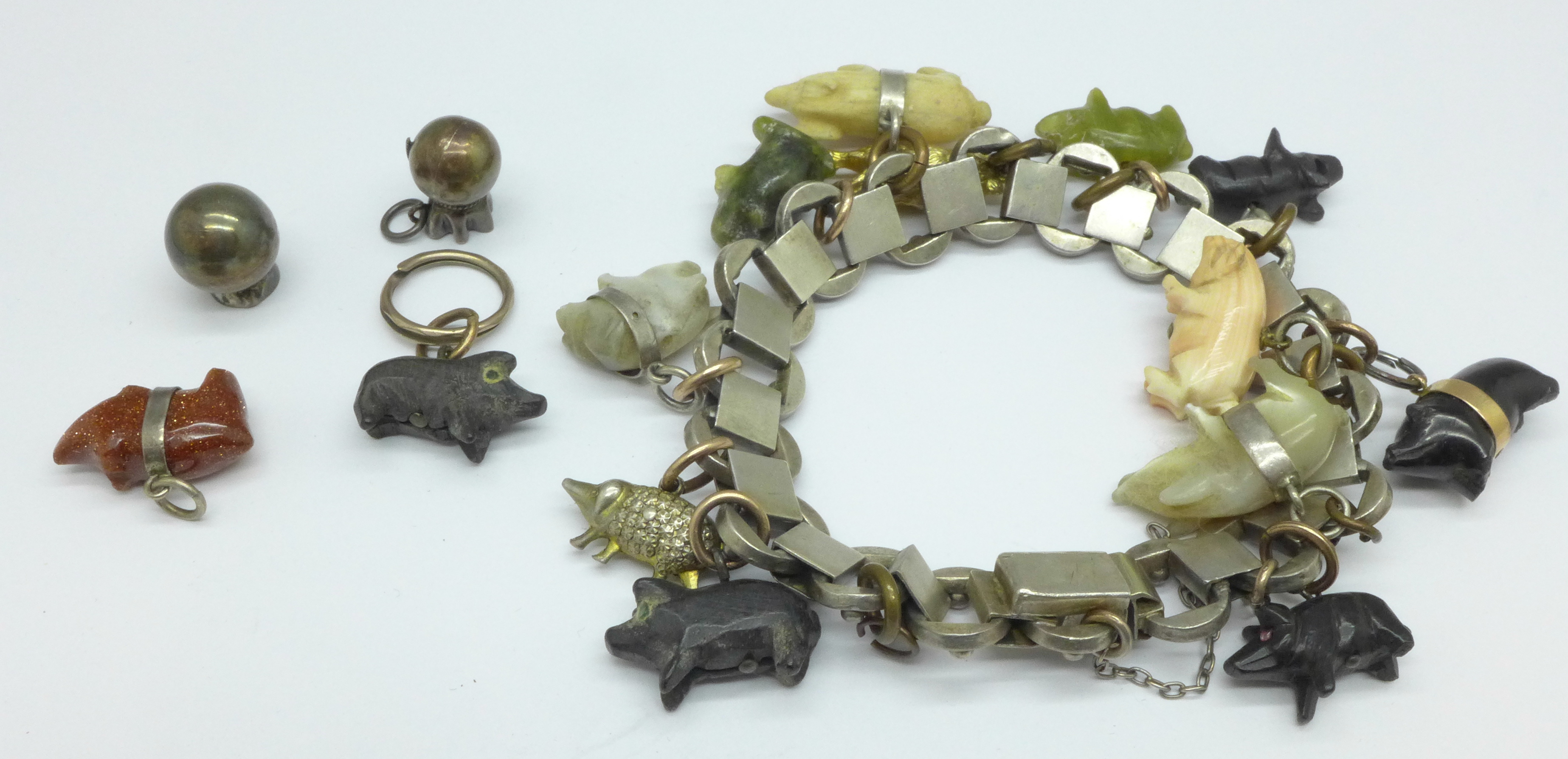 A novelty pig charm bracelet, set on a converted Victorian collar