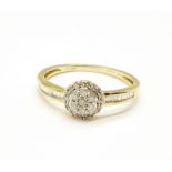 A 9ct gold, diamond cluster ring with diamond shoulders, 1.9g, S