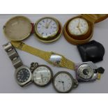 A collection of watches and clocks including a Looping 8 days travel alarm clock