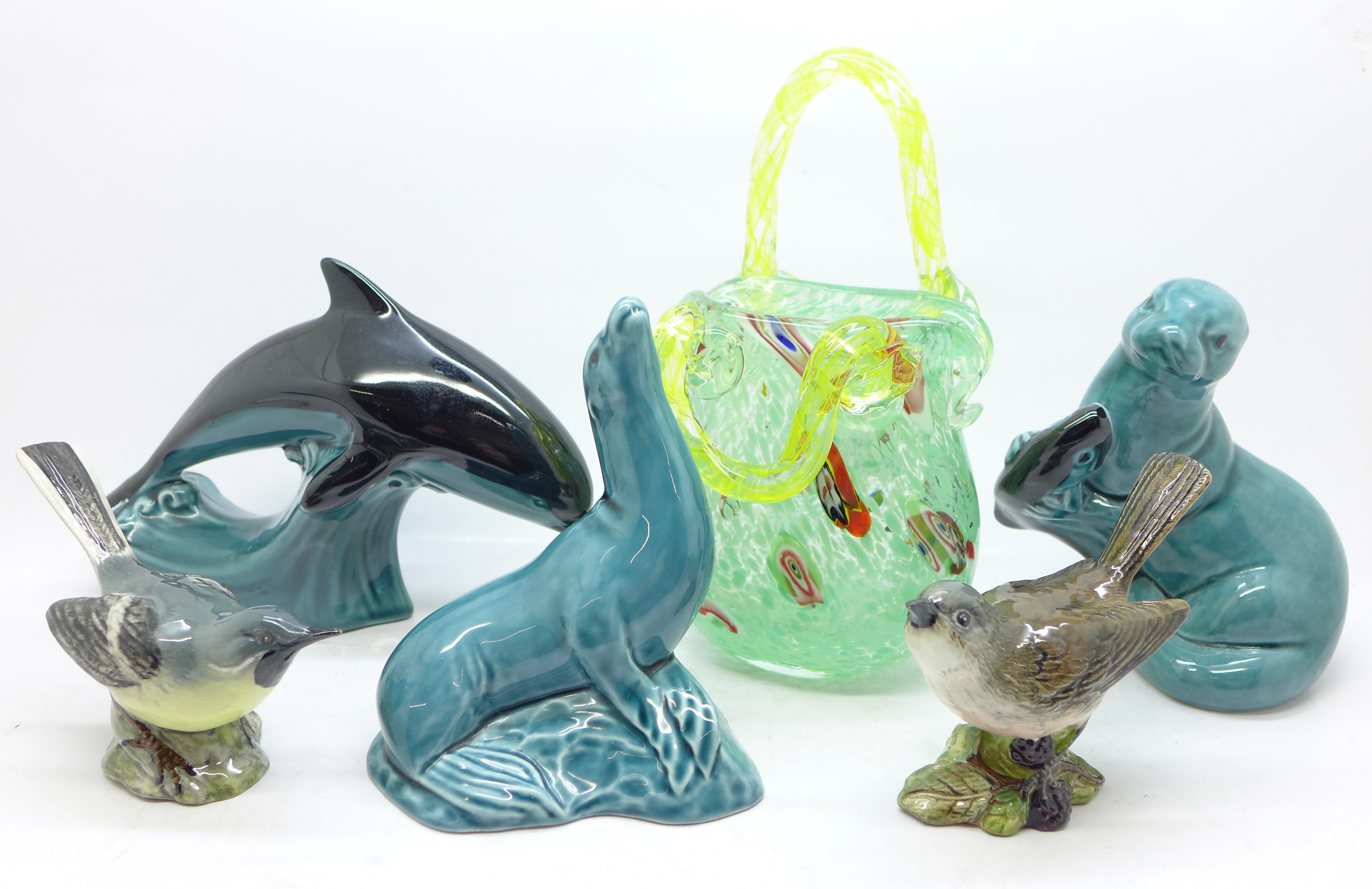 Three items of Poole Pottery including a dolphin, two Beswick bird figures, Whitethroat and Grey