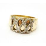 A 9ct gold ring set with diamond 'snake' design, 5g, P