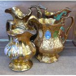 Four 19th Century lustre jugs including one with clock dial