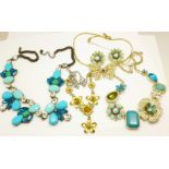 Four statement necklaces and a pair of earrings