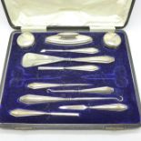 An eleven piece silver manicure set, cased, no scissors