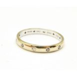 A 14ct gold, diamond set eternity ring, 2.4g, P