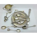 Seven silver spoons, a silver handled grapefruit knife, a small silver jug, a plated tray, etc., (
