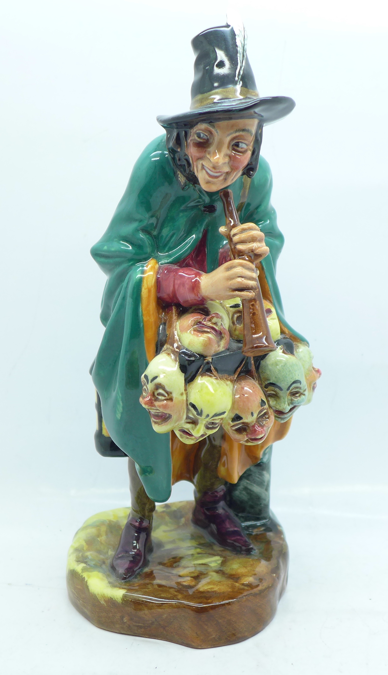 A Royal Doulton figure, The Mask Seller, HN2103