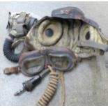 A WWII airman's leather flying helmet, goggles and mouthpiece, a/f