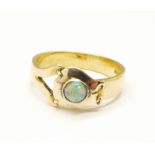 An 18ct gold and opal solitaire ring, 3.9g, L
