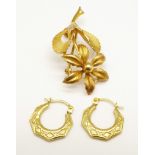 A 9ct gold brooch and a pair of earrings, 3.3g
