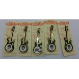 A set of five Beatles Invicta Plastics guitar brooches