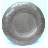 A hand beaten copper circular plaque, 36cm