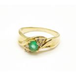 A 14ct gold, emerald and six diamond ring, 4.6g, R