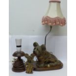 A wooden table lamp with carved wooden dog, possibly pre-war, one other lamp and one other carved