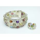 A white metal bangle and similar 925 silver ring set with topaz, amethyst, aquamarine, garnet and