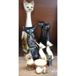 A collection of cat figures, two a/f