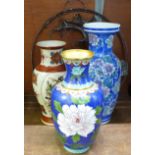 A cloisonne vase, two oriental vases and two Chinese wall hangings