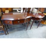 Two mahogany serpentine hall tables