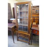 An oak bookcase on stand