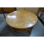 A Nathan teak circular coffee table