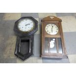 An oak wall clock and an ebonised wall clock