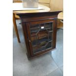 A mahogany cabinet, bearing Asprey Jewellers inscription to the door